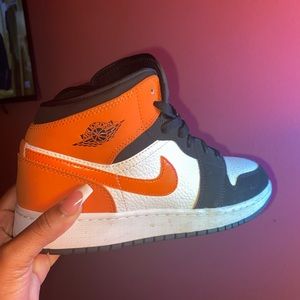 Orange and black Air Jordan 1s